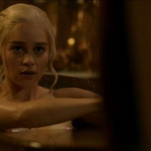 Emilia Clarke sitting in bath tub nipple peaking out of water