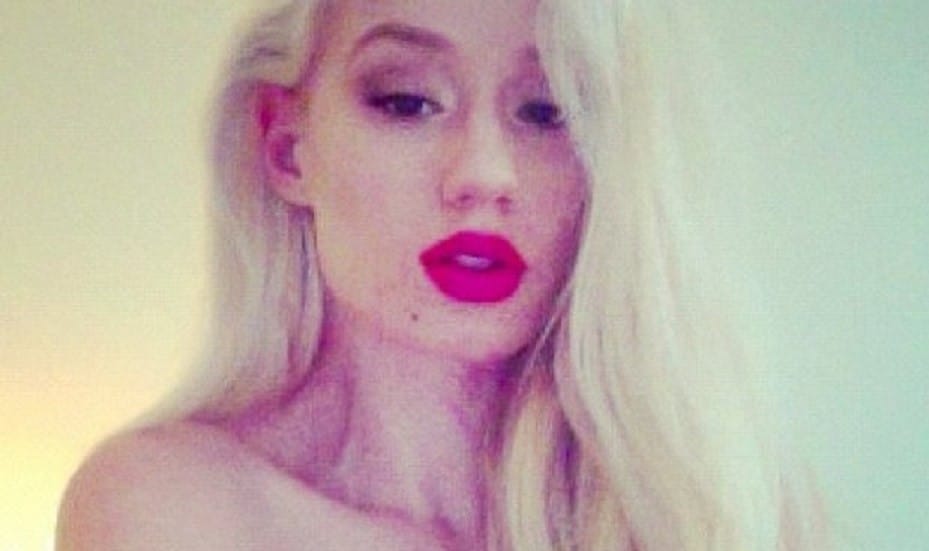 Singer Iggy Azalea with red lipstick on looking seductive