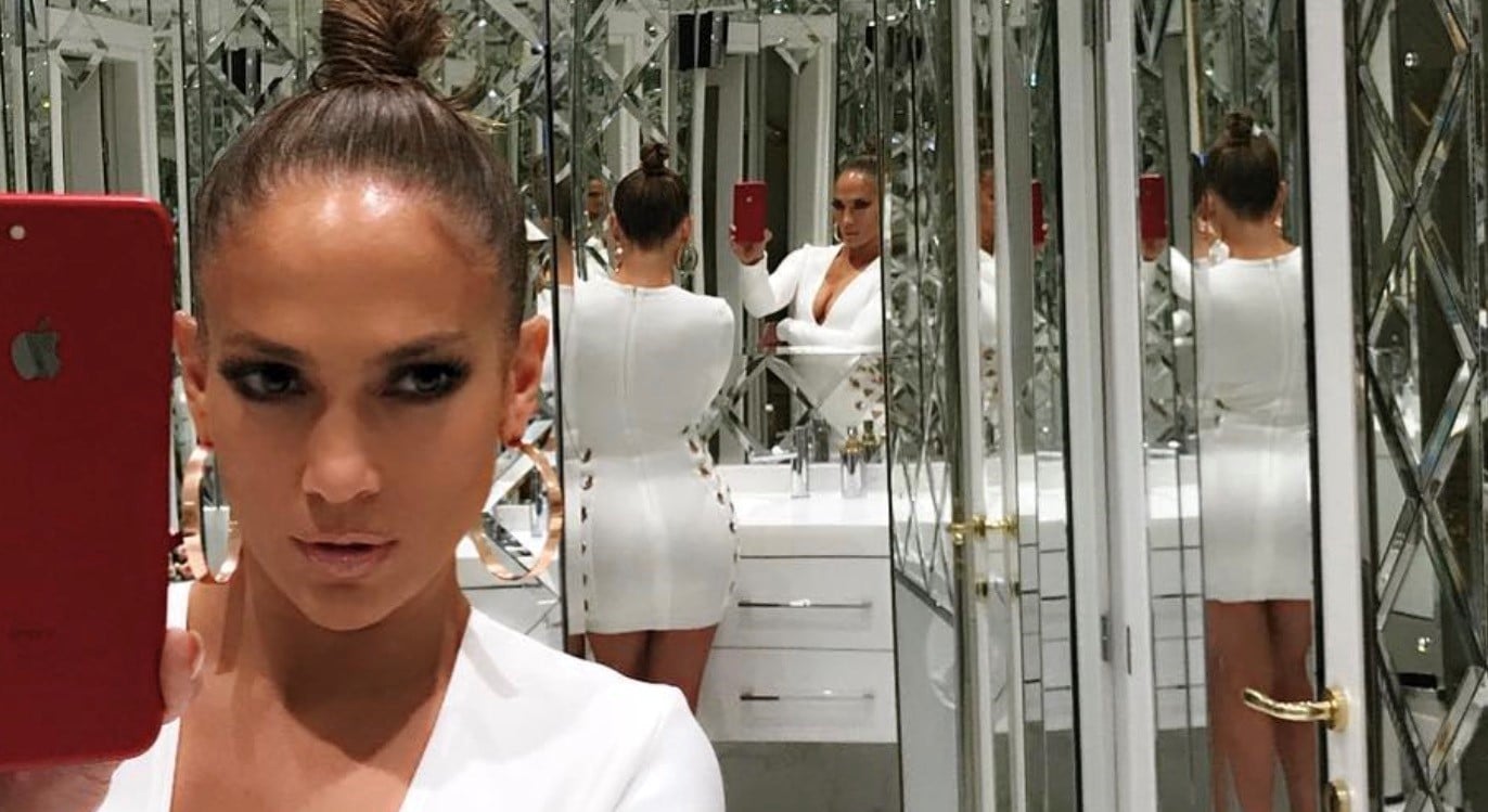 Jennifer Lopez taking a selfie in a room of mirrors