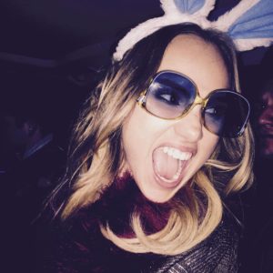 Suki Waterhouse with mouth open and bunny ears