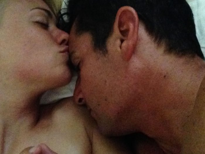 Yvonne Strahovski kissing a man's forehead